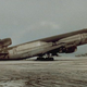 A McDonnell-Douglas DC-10 owned by World Airways rests on its tail due to heavy ashfall deposited by the eruption of Mount Pinatubo in 1991.